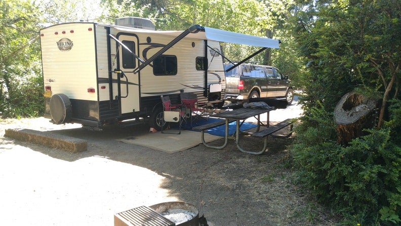 Truck and RV parked at RV campsite in Bullards Beach State Park 