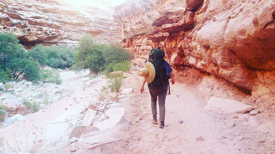 hiker on trail while camping in Havasu Falls