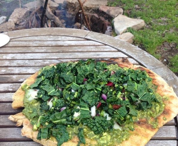 outdoor cooking collard green pesto pizza