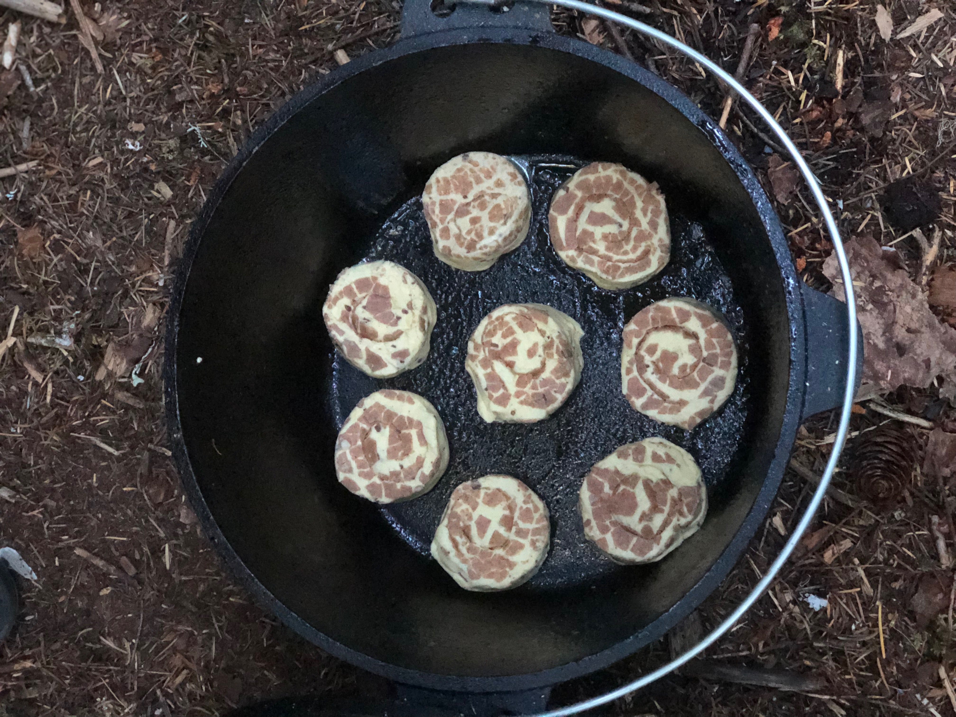 raw cinnamon rolls in a dutch oven