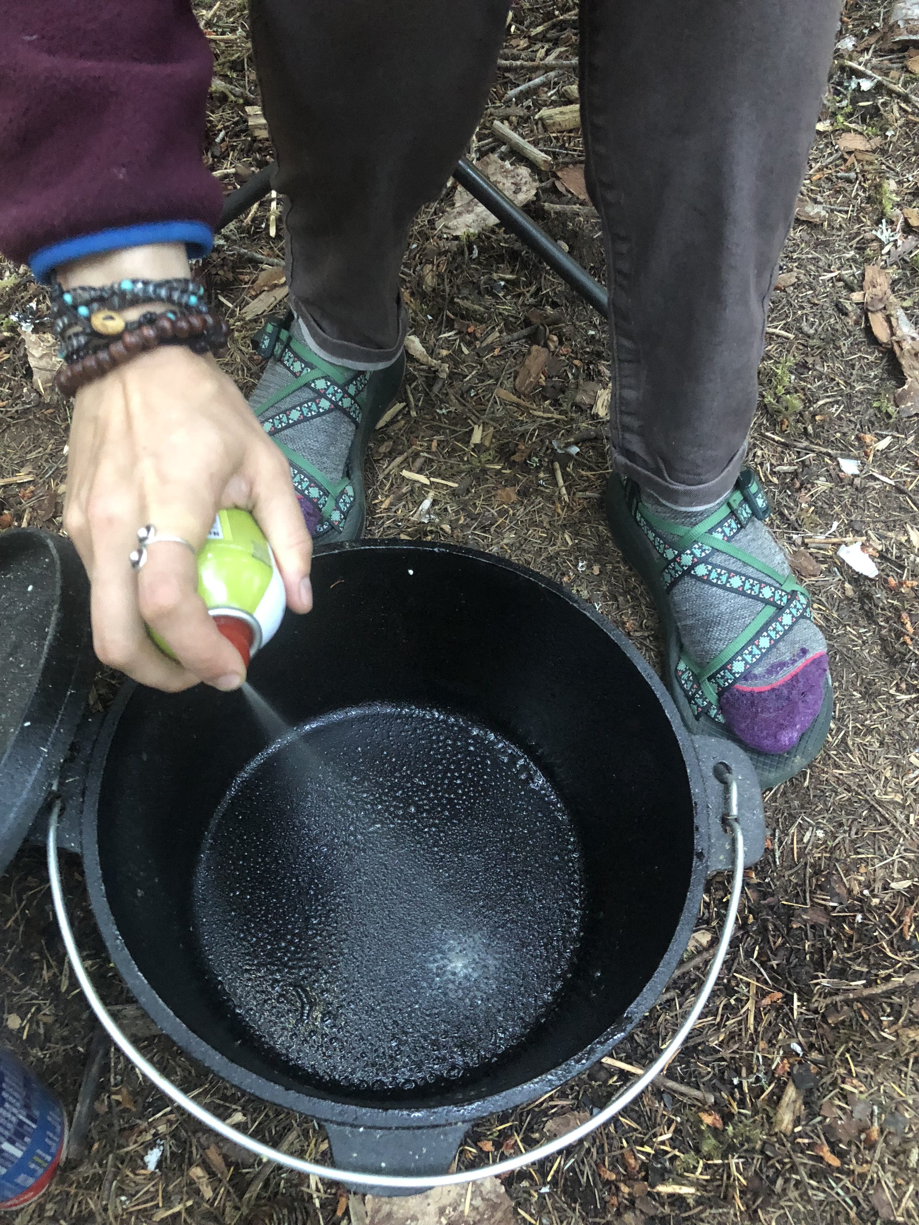 greasing a dutch oven for easy cinnamon rolls