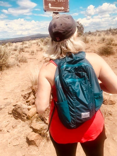 sarah testing out her ultralight backpacking pack