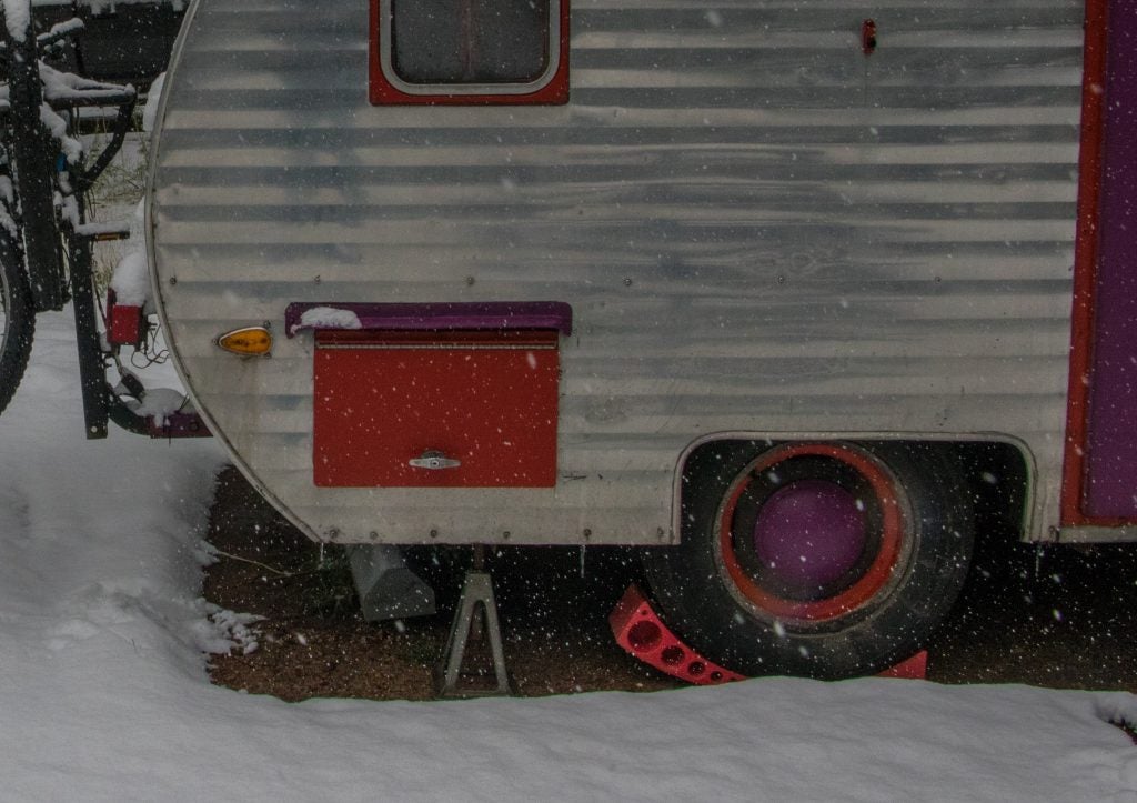 camper trailer leveled in the snow