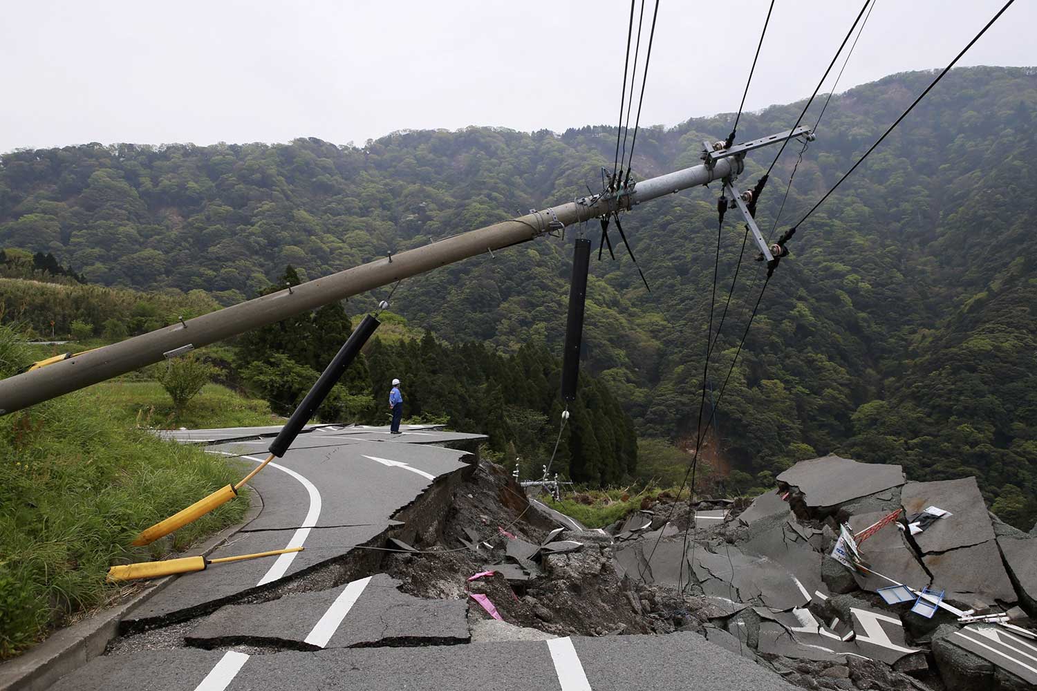 landslide wipes out freshly paved road and powerlines