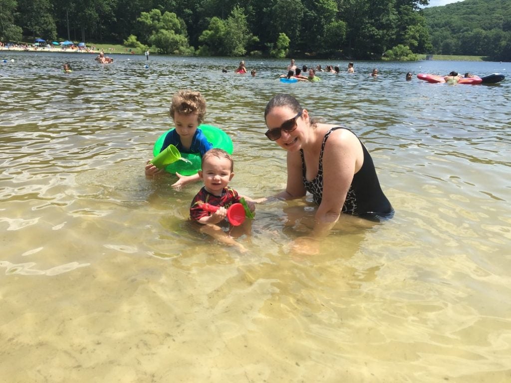 A mother with her two children in the shallow waters of the lake at Cunningham Falls State Park