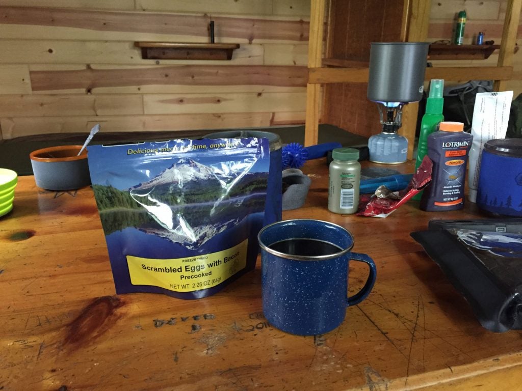 a freeze dried breakfast with a cup of coffee