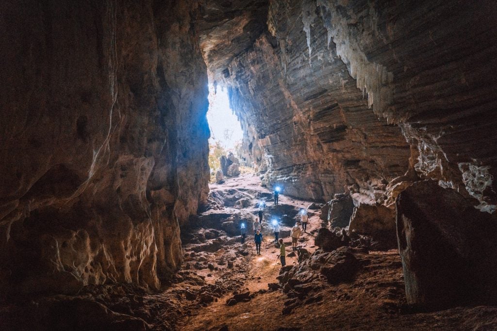 spelunkers enter a cave in kentucky