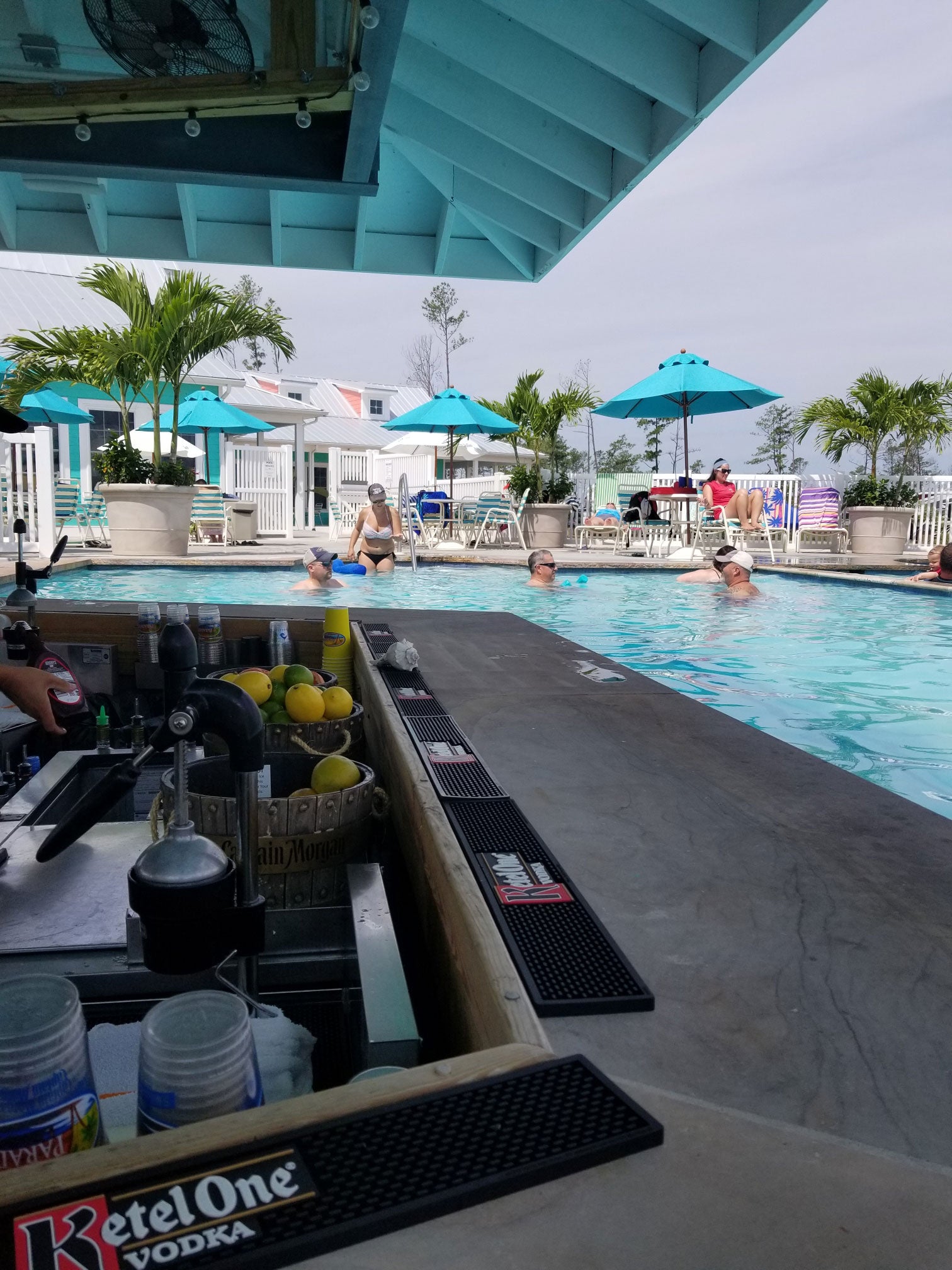 Swimming in the Caribbean-inspired pool with a swim-up bar at Massey's Landing