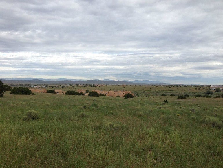 panormaic view of santa fe skies rv park on a cloudy day