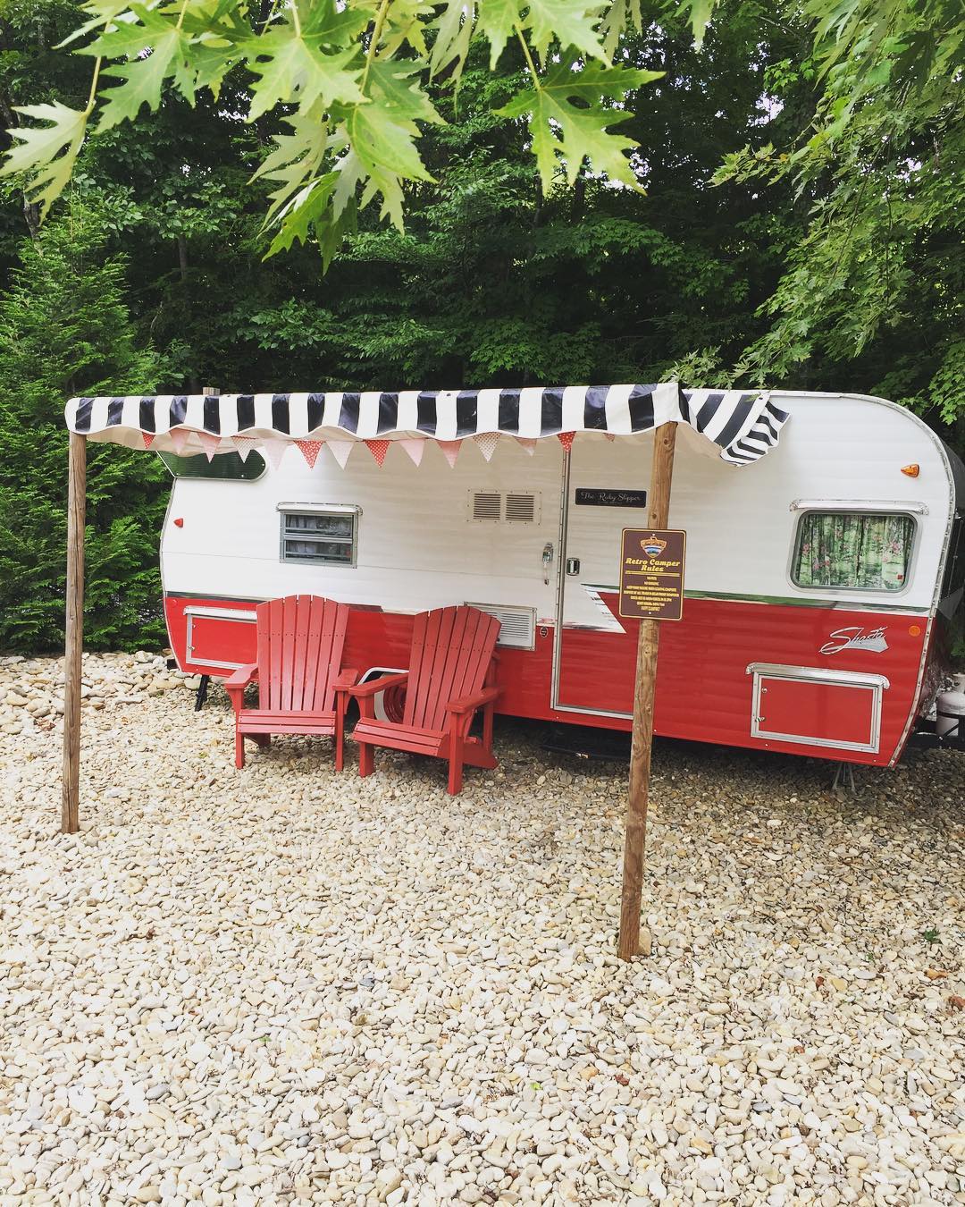 vintage trailer with covered roof and lounging area