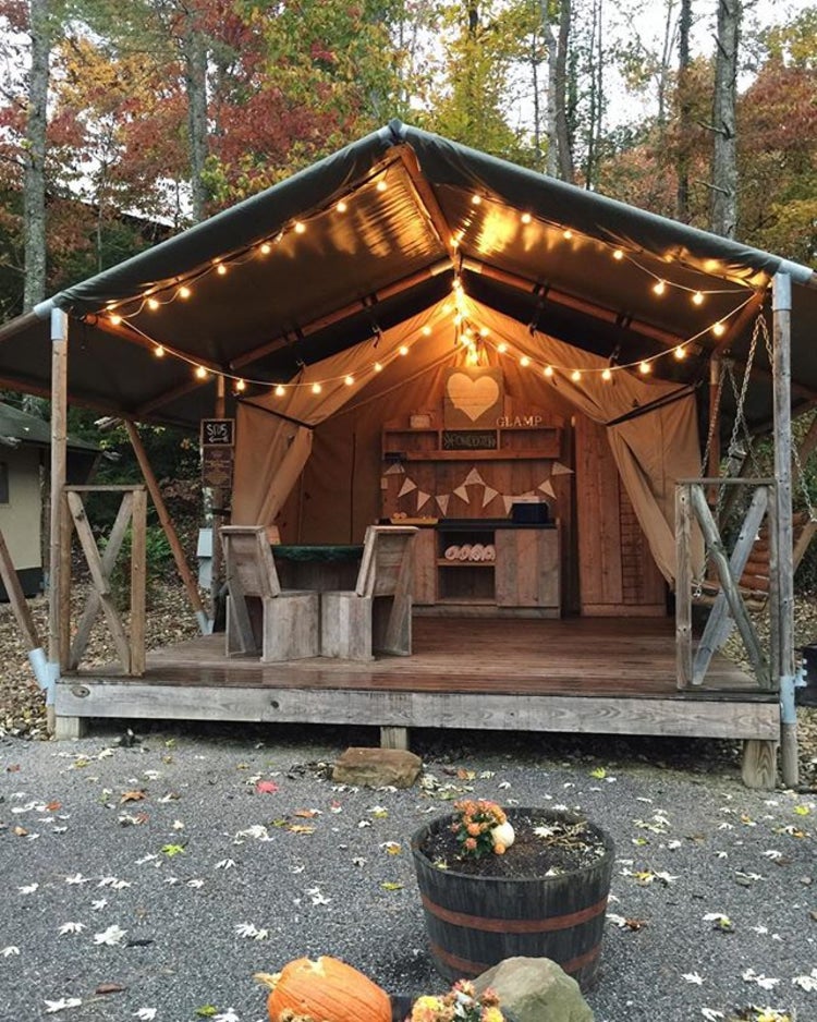 a glamping tent with string lights at a gatlinburgh campground