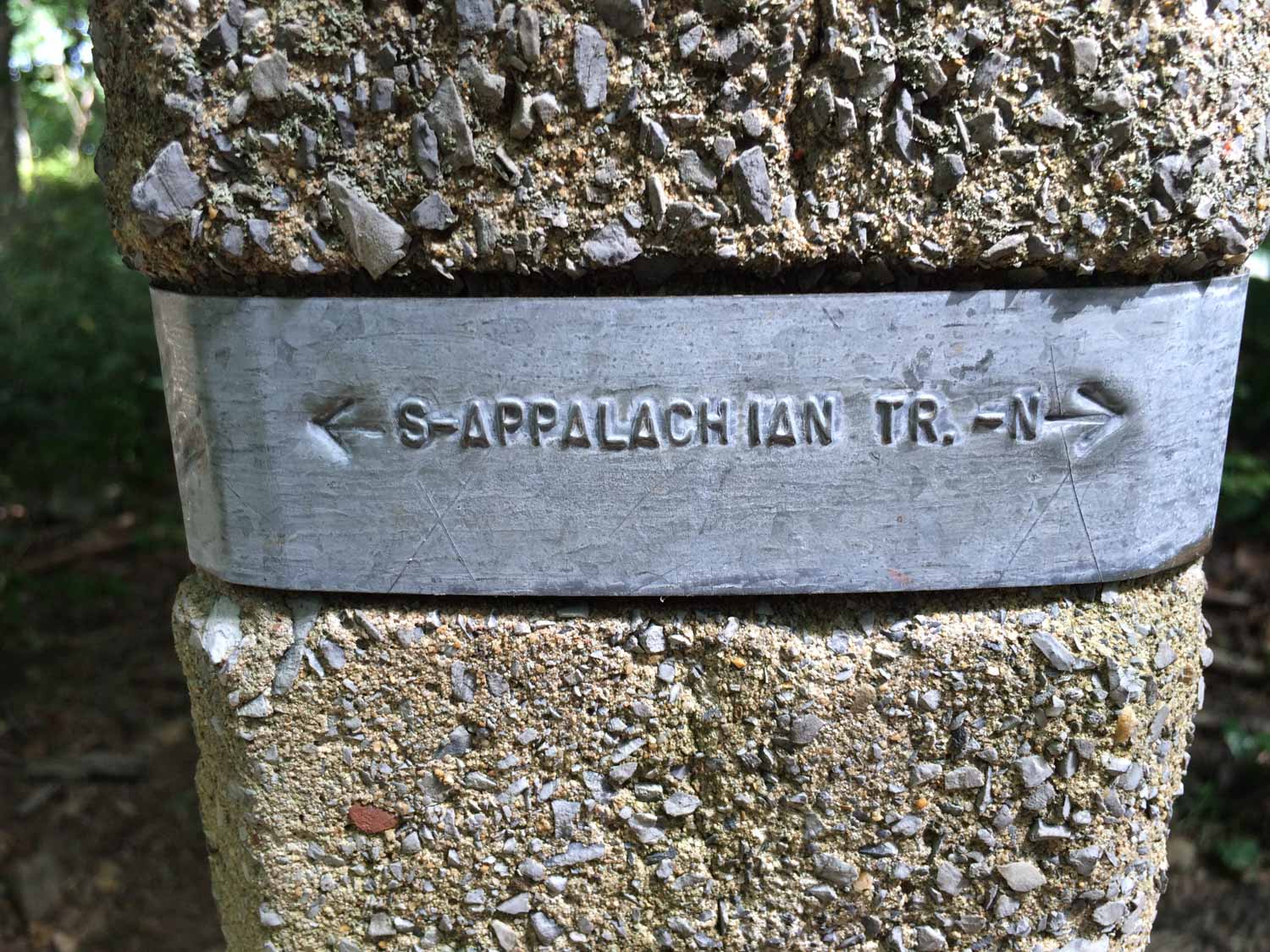 metal and stone Appalachian Trail marker in Shenandoah National Park