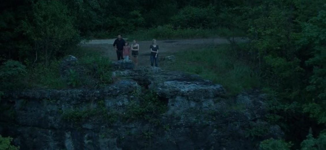 ozark tv screencap of the Byrde family staring out over a bluff in the forest at night