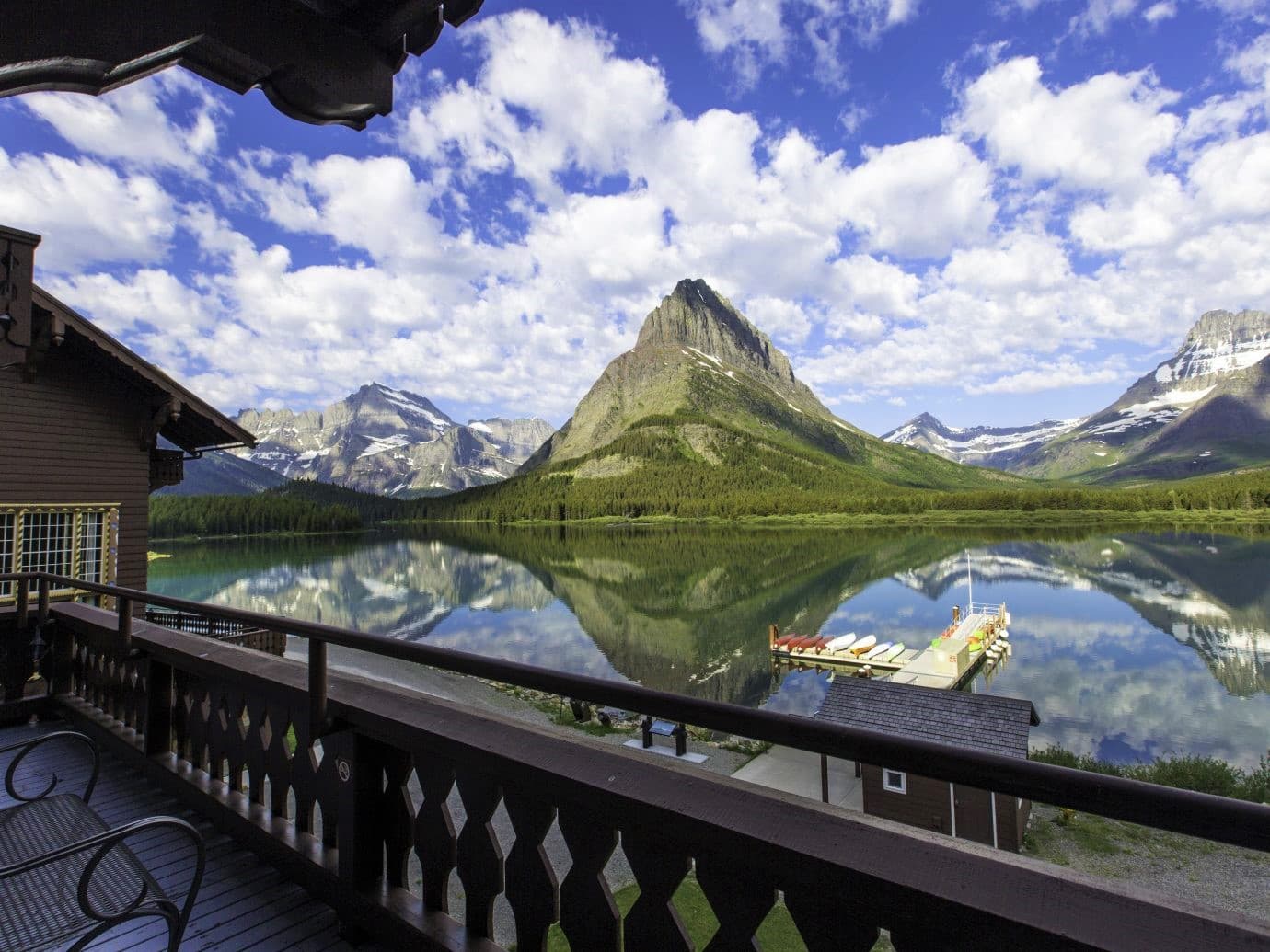 Overlook at Lake McDonald, surrounded by mountains, and boat dock