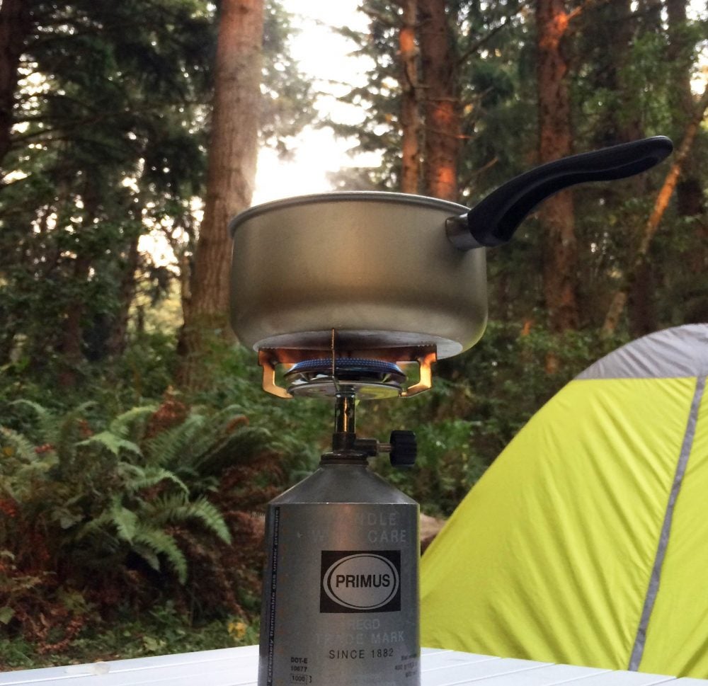 primus backpacking stove in the Redwoods with tent in background
