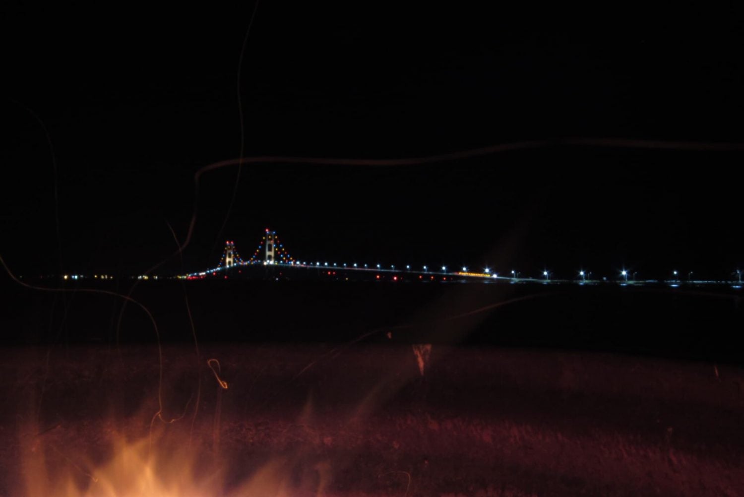 night view of the Mackinac Bridge over Lake Michigan from campsite in Straits State Park