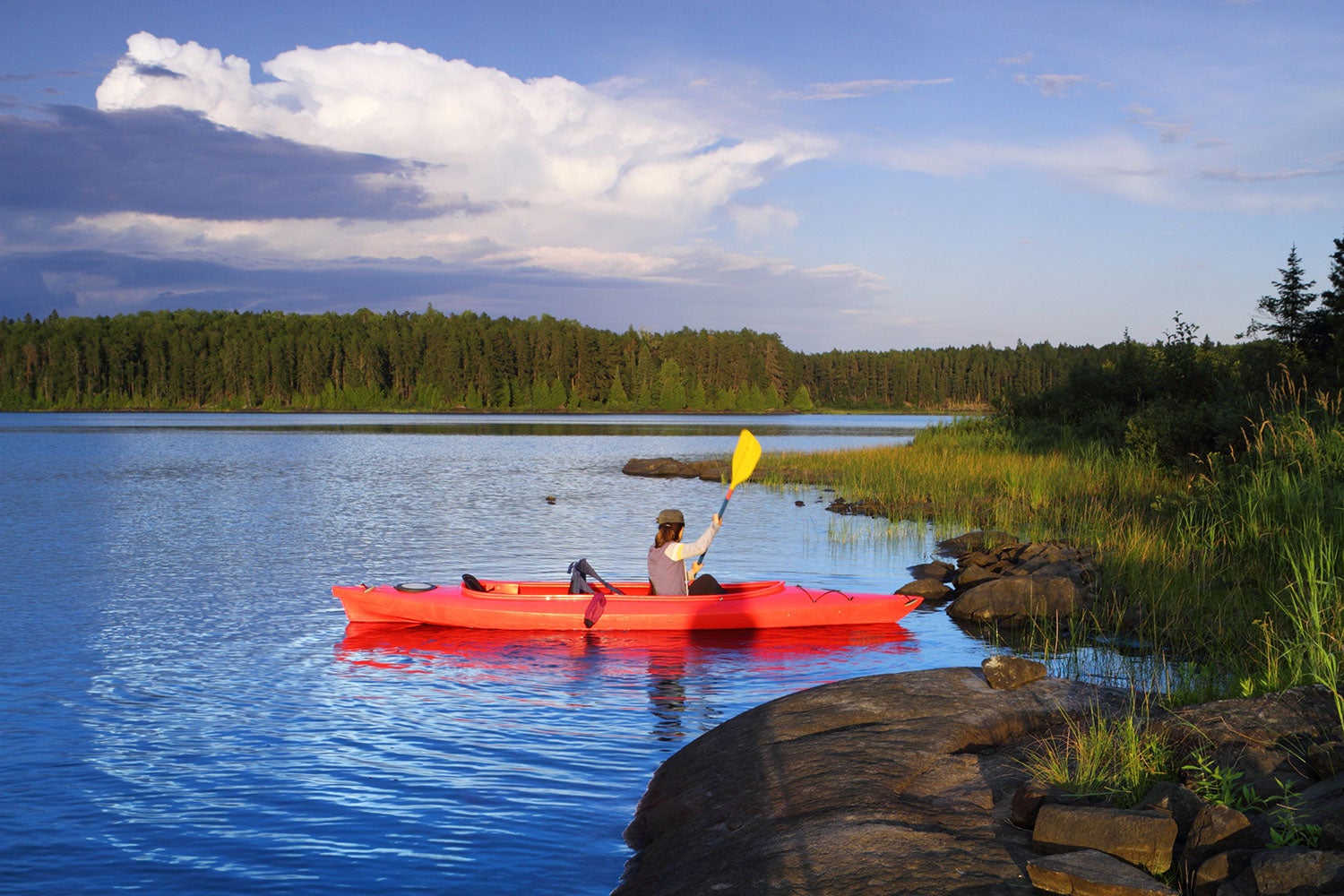 woman kayaking in minnesota national parks