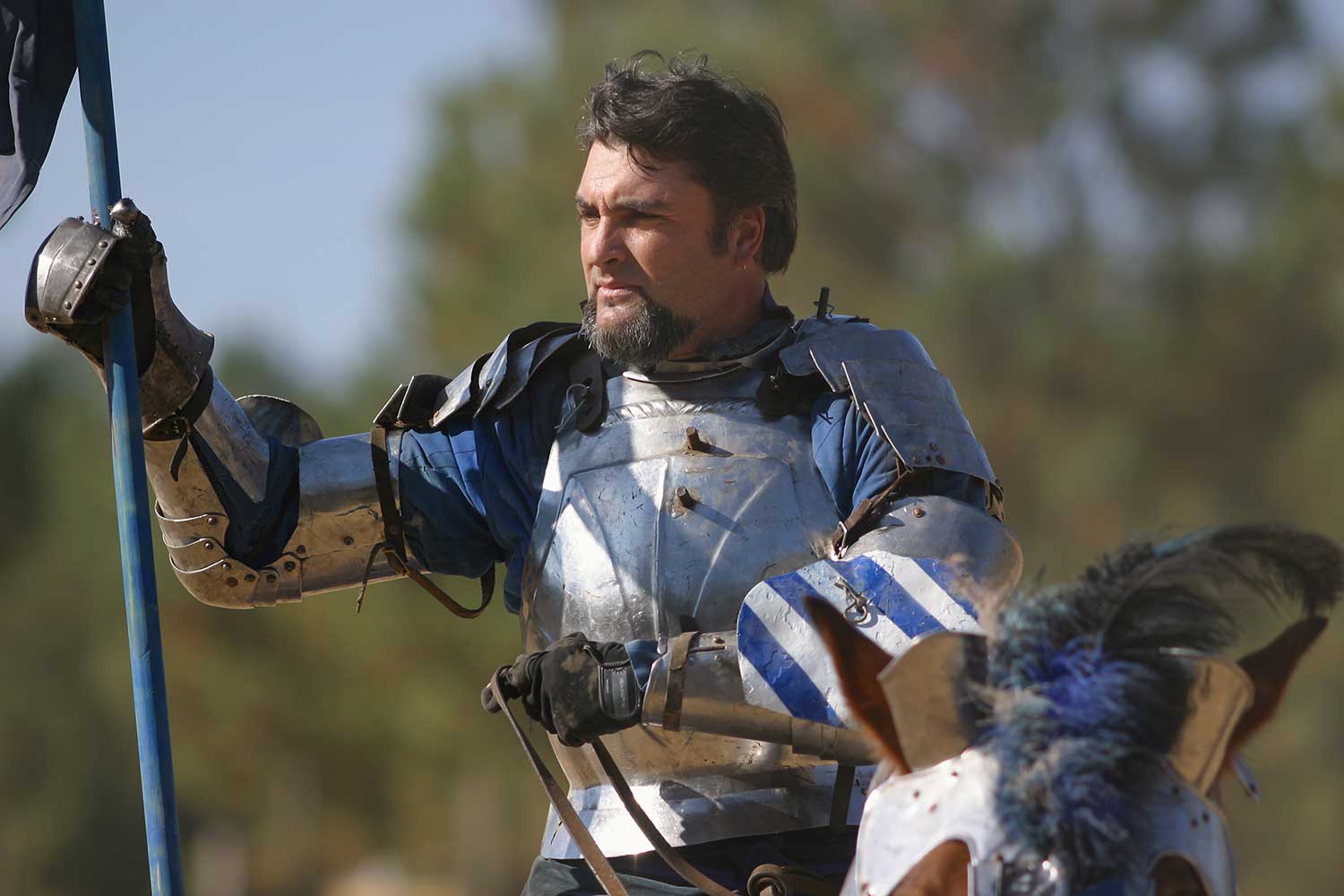 knight with a joust riding a horse at the louisiana renaissance festival