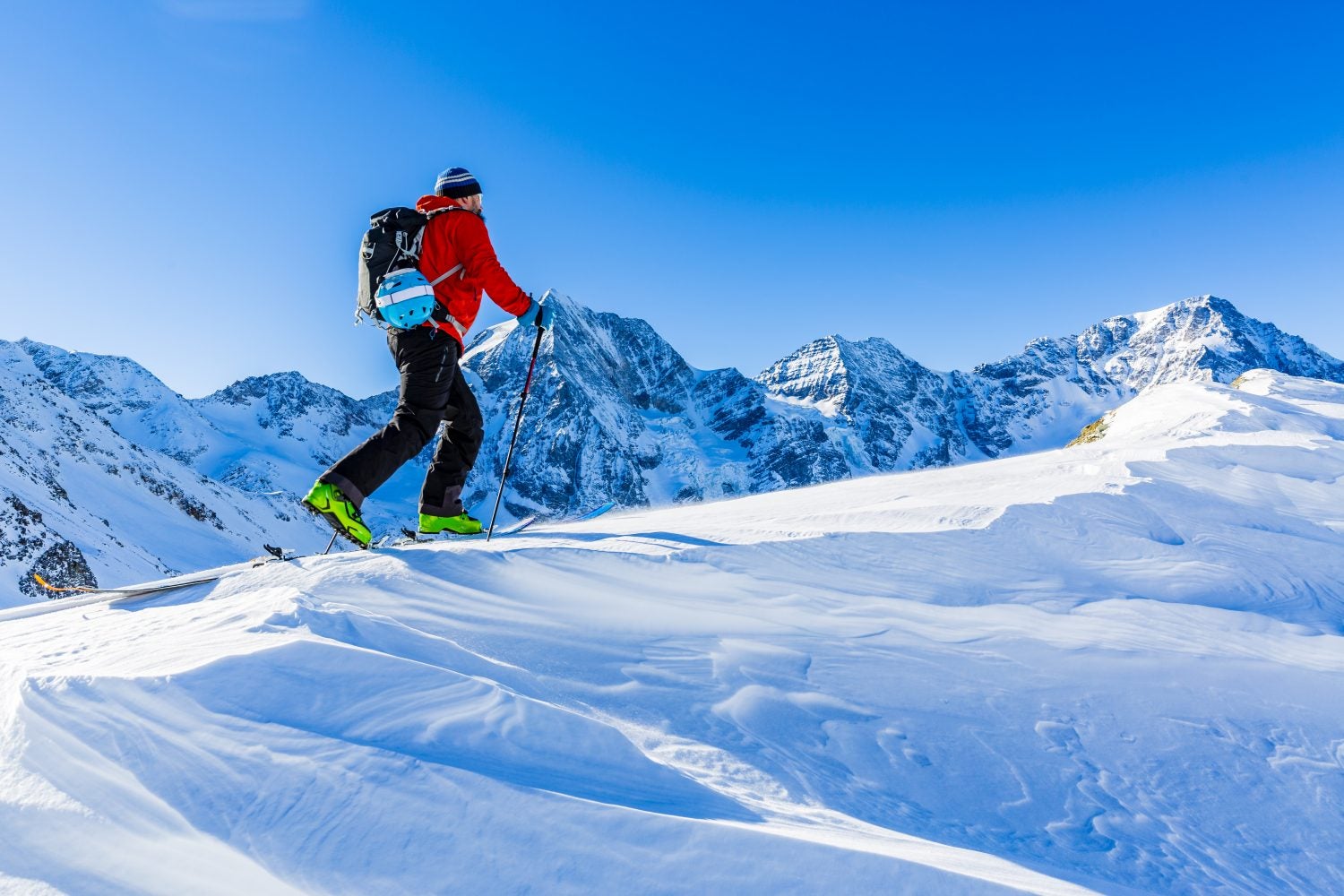 Man skiing on top of a mountain