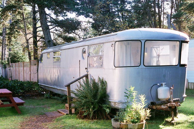a vintage trailer made of steel rests grounded at the Sou'wester Lodge in Washington
