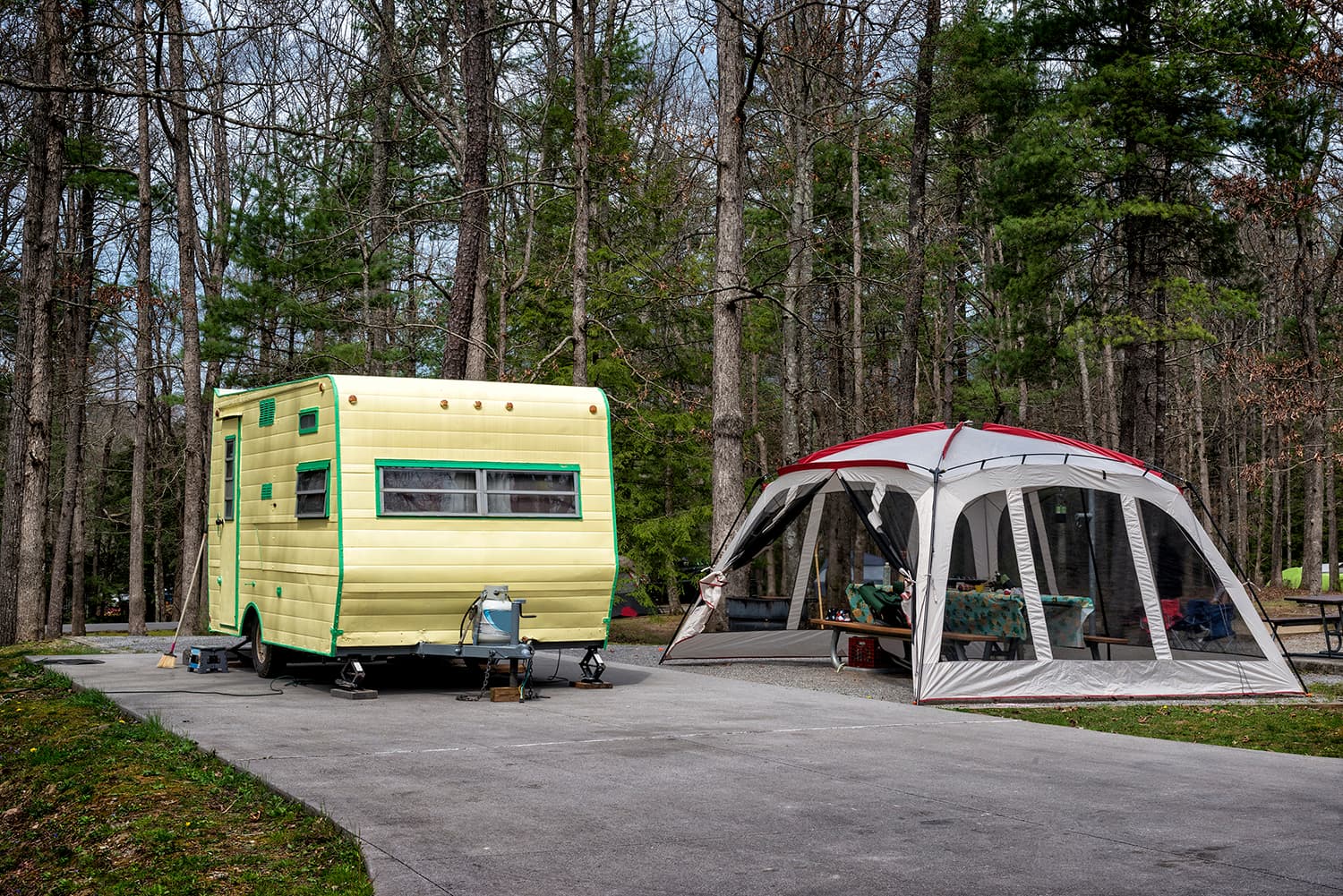 vintage trailer and day use tent in a smoky mountain campsite