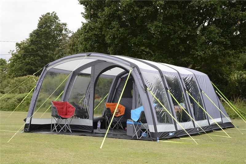kampa hayling tent with many windows and rooms set up in a field on a cloudy day