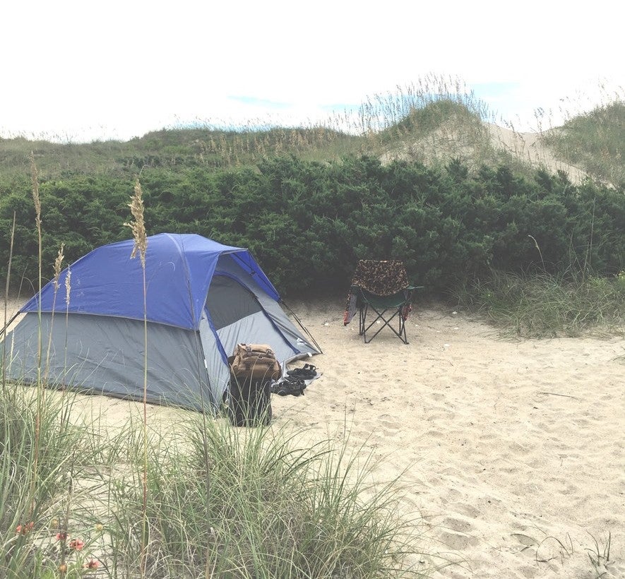 a tent in the sand at an Outer Banks camping site