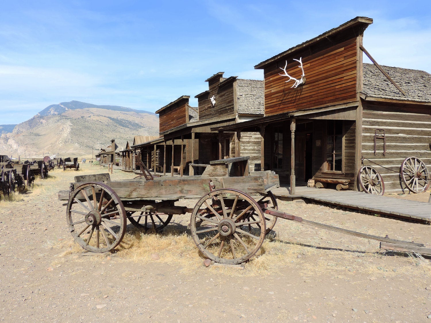 Wagon in front of old and rustic building in Cody, Wyoming
