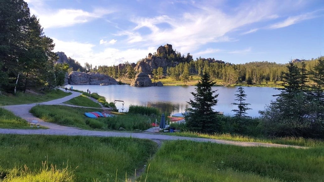 colorful canoes and kayaks on the shores of stockade lake