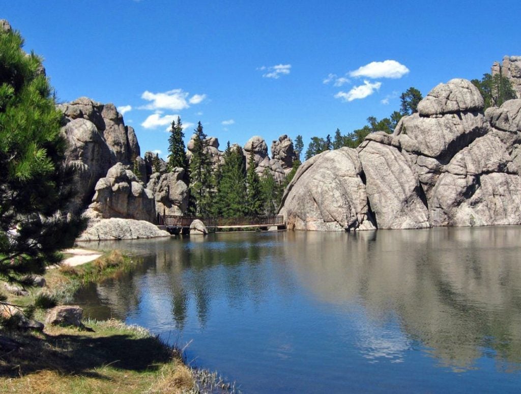 sylvan lake nestled in tall pines and round rocks