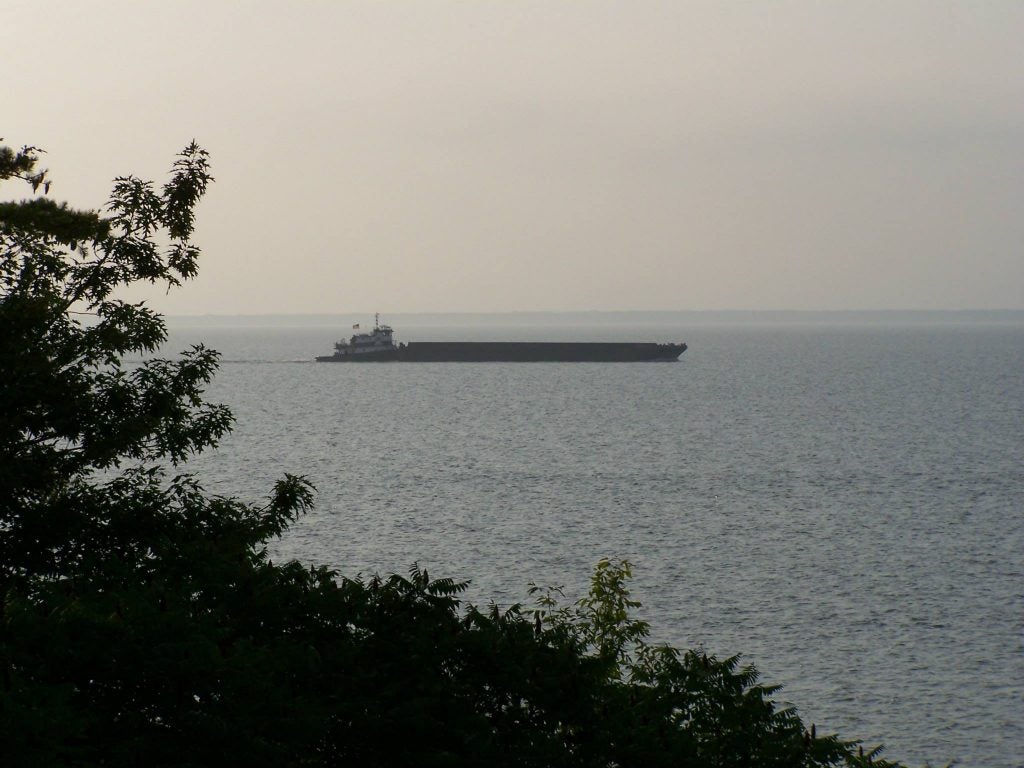 a ship dry docked on a sand bar in the great lakes