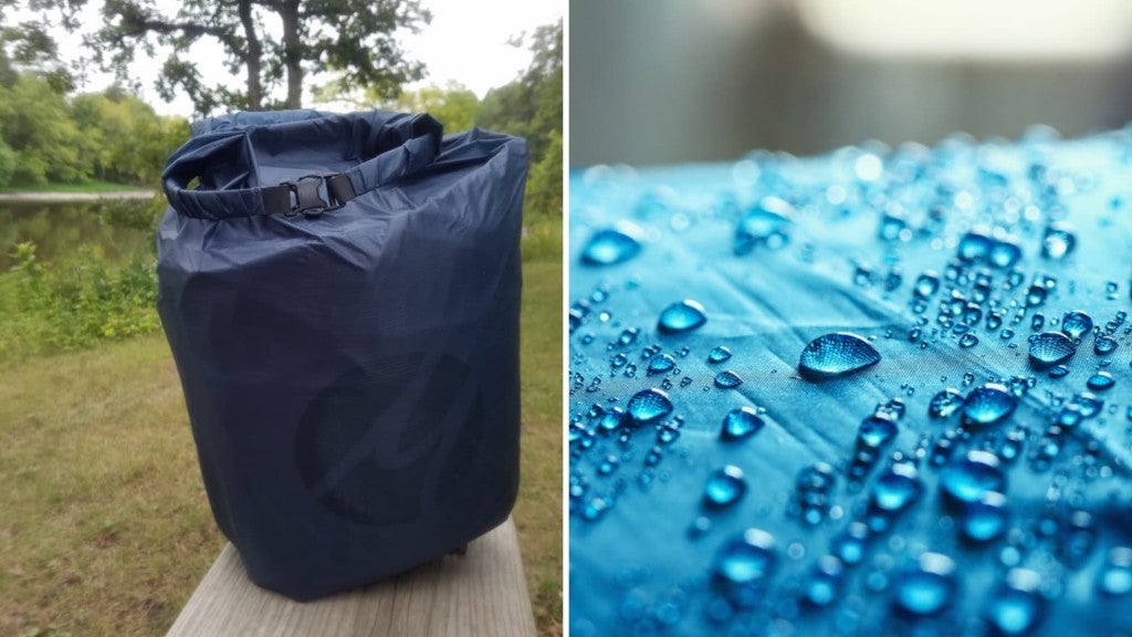 (left) navy blue dry bag sits on bench with greenery and river in background (right) bright blue waterproof fabric with water beading off it 