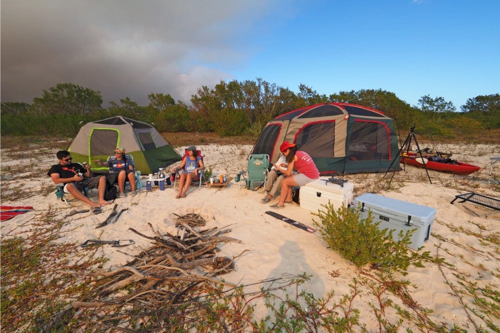 campers hanging out on the beach
