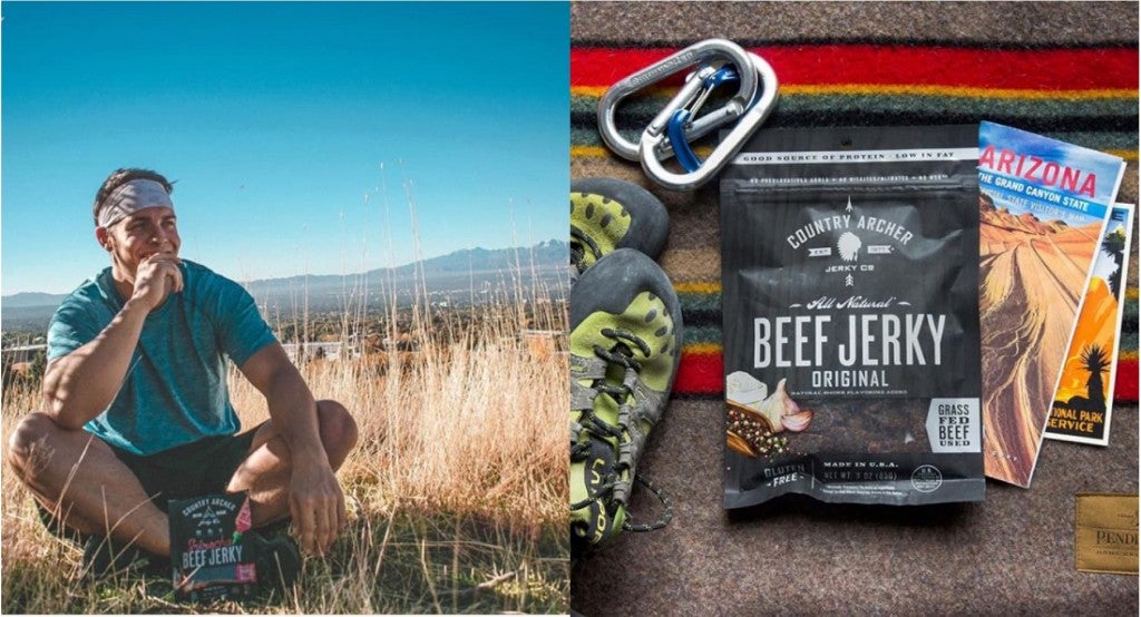 (left) a man sitting on the ground eating a healthy jerky bar (right) a pack of country archer beef jerky sits amongst hiking and climbing gear