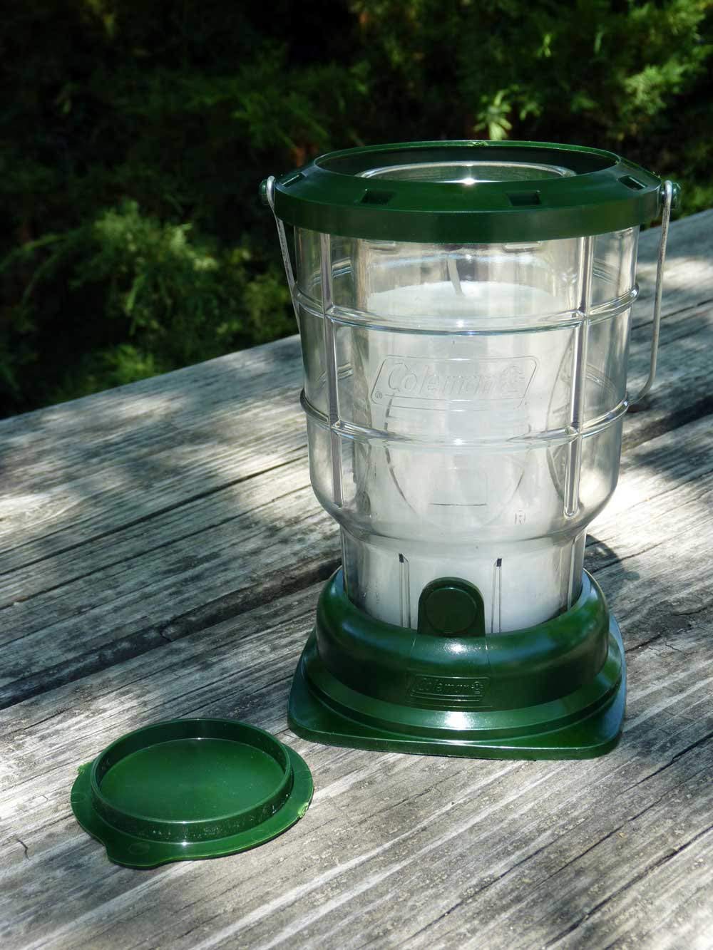 Citronella candle placed on picnic table 