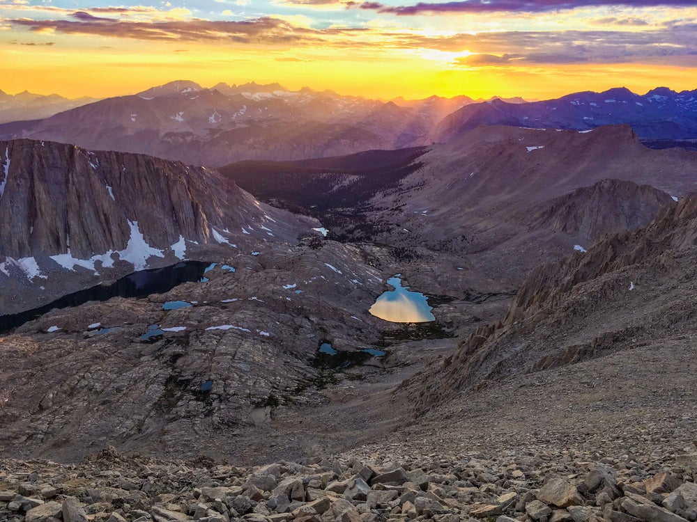 Lake in the middle of a big valley at colorful sunset