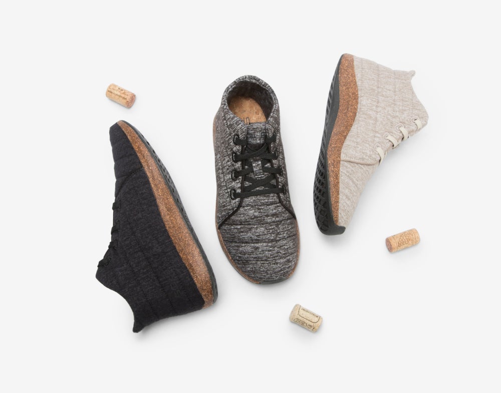 three individual Jasper Wool Eco Chukka eco-friendly shoes next to three corks