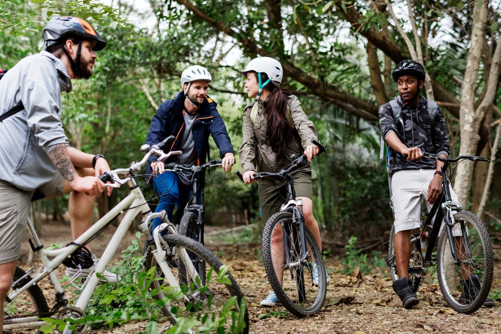 a Group of people taking a break while mountain biking.