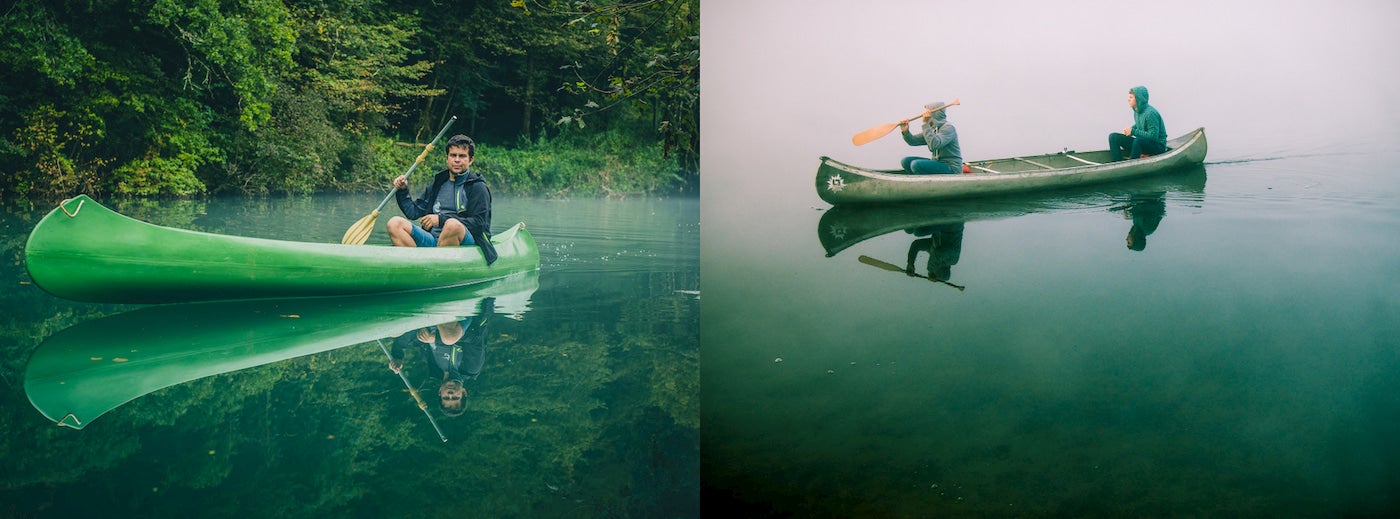 Person paddling alone in a canoe and two people paddling together in a canoe.