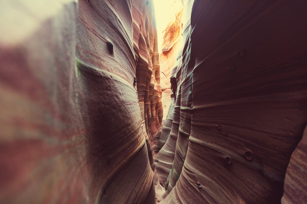 Striated rock walls of Zebra Slot Canyon.