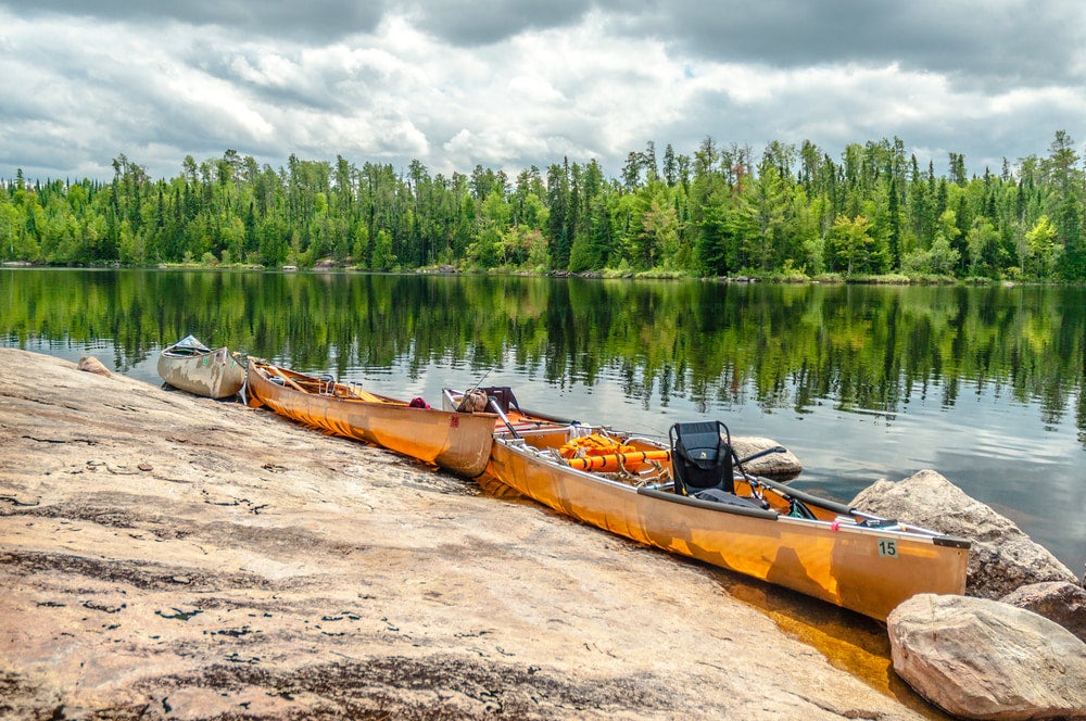 Canoes tied up at waters edge in the Boundary waters.