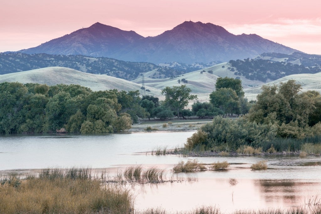 Mt. Diablo at sunset from banks of a waterfront