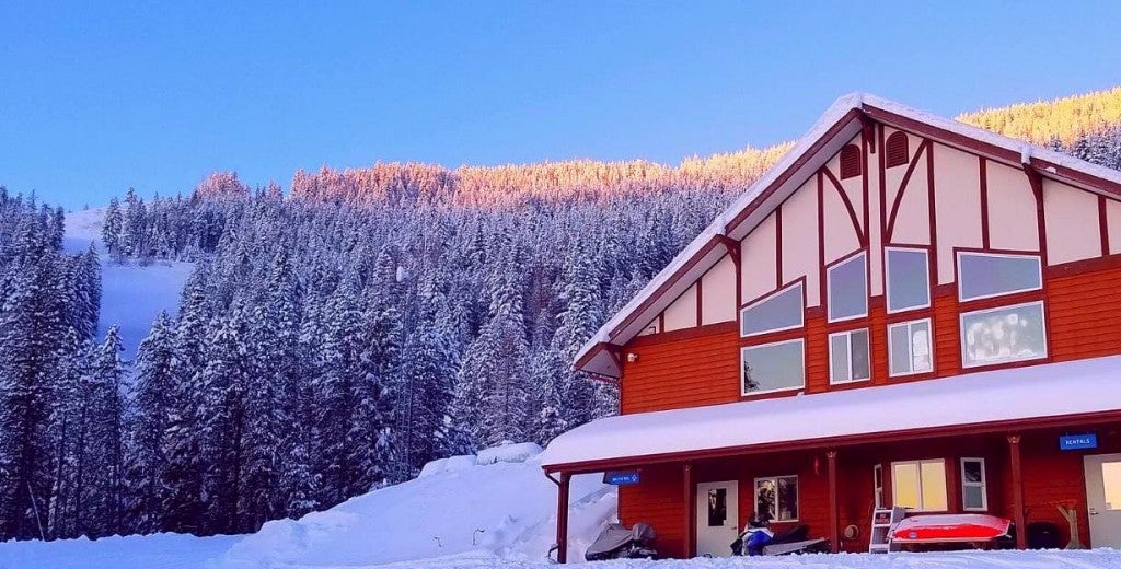 ski lodge at foot of snow covered ski runs