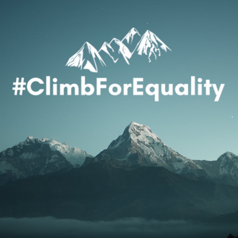 a landscape view of the mountains with climb for equality written over them