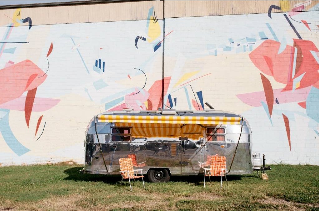 an airstream trailer parked and in use by campers