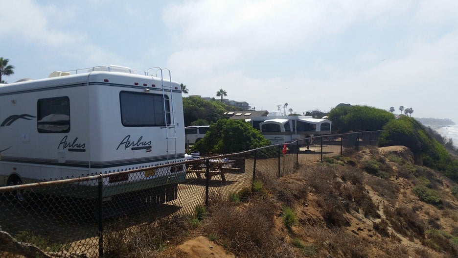 RVs parked on the edge of the beach at South Carlsbad State park 