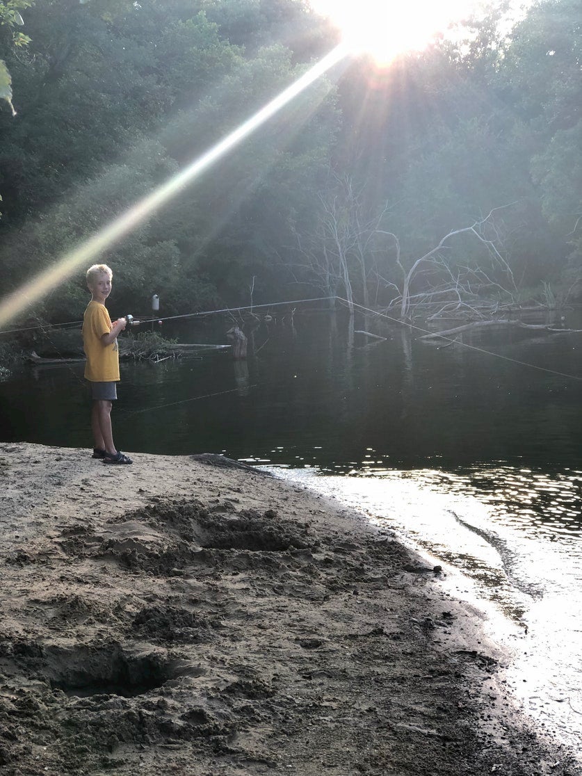 Young boy fishing in Clinton Lake.