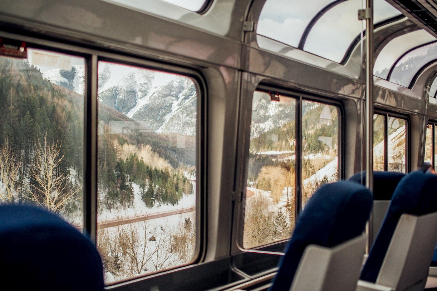 Western alpine landscape from the windows of a AMTRAK train car.