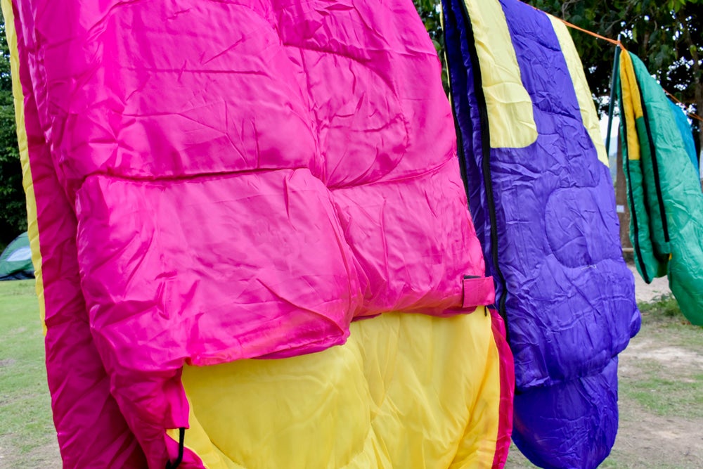 Drying sleeping bags on a clothesline.