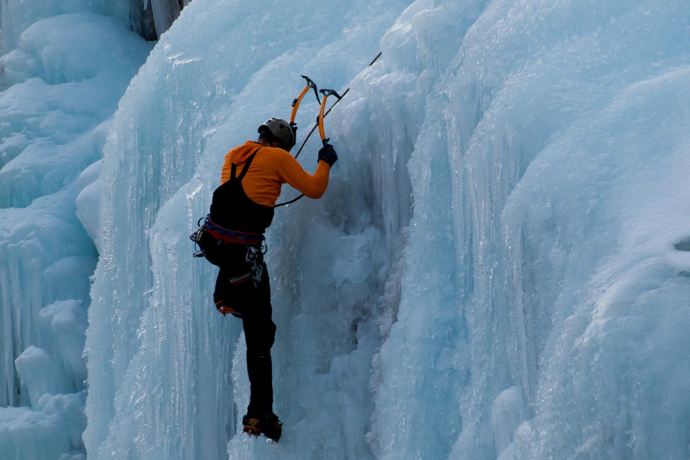 Ice climber climbing in Box Canyon.